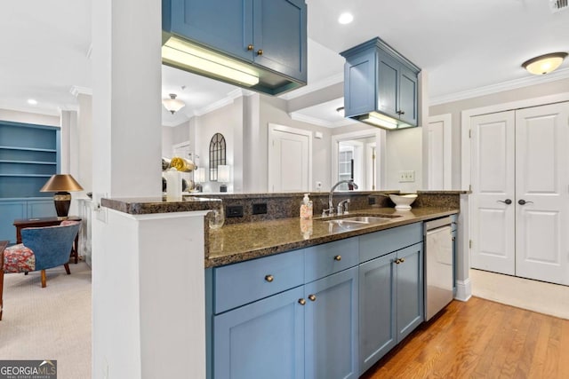 kitchen with sink, crown molding, dishwasher, kitchen peninsula, and dark stone counters