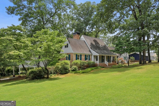 cape cod house featuring a front lawn