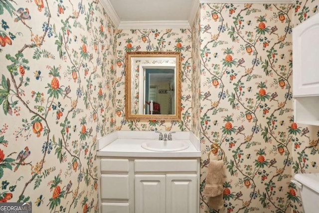 bathroom with vanity, toilet, and crown molding