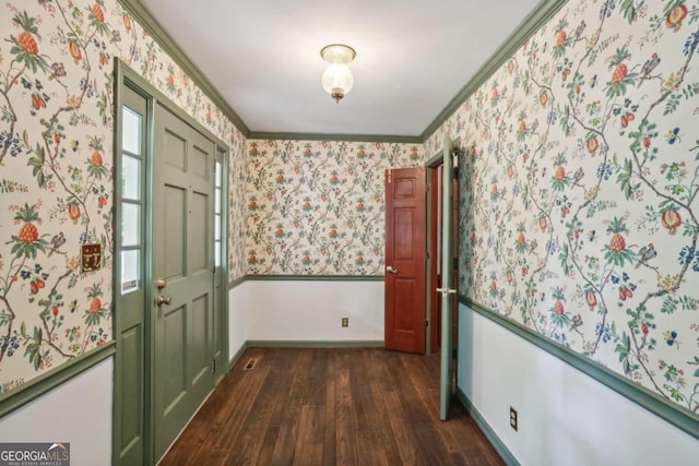 interior space featuring dark hardwood / wood-style floors and ornamental molding