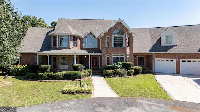 view of front of home featuring a garage and a front lawn