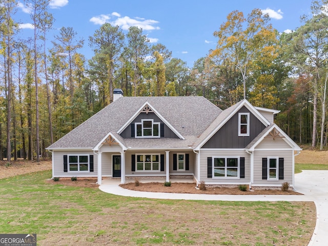 craftsman-style home with a front yard