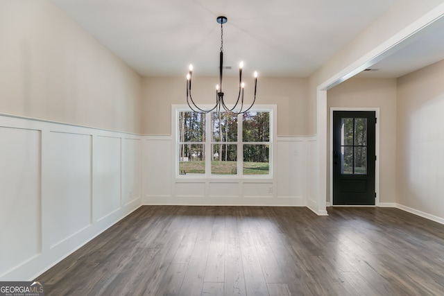 1797 Star Point Rd, Carrollton, GA 30116 - unfurnished dining area featuring a decorative wall, a chandelier, dark wood-type flooring, and a wainscoted wall