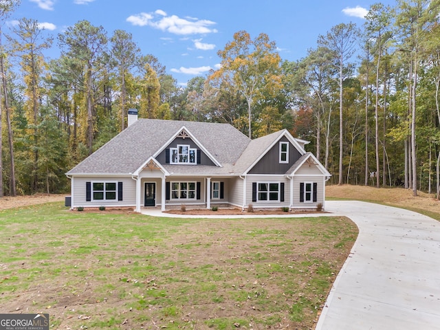 craftsman-style house with a porch and a front lawn