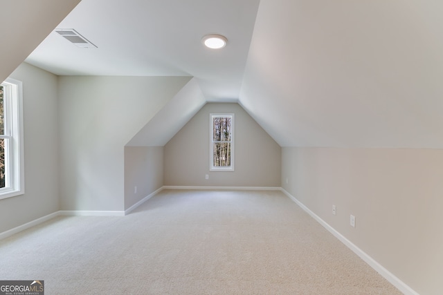 1797 Star Point Rd, Carrollton, GA 30116 - additional living space with light carpet, vaulted ceiling, and baseboards