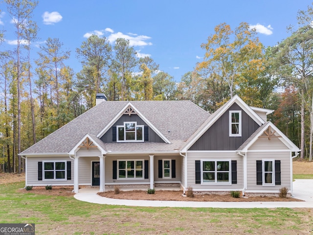 craftsman-style house with a front lawn