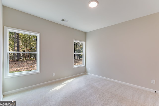 empty room with light colored carpet