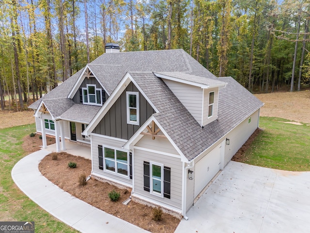 craftsman-style house featuring a front yard and a garage