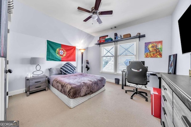 bedroom with light colored carpet and ceiling fan