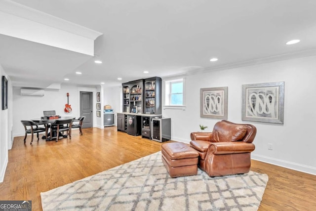 interior space featuring a wall mounted air conditioner, crown molding, and wood-type flooring