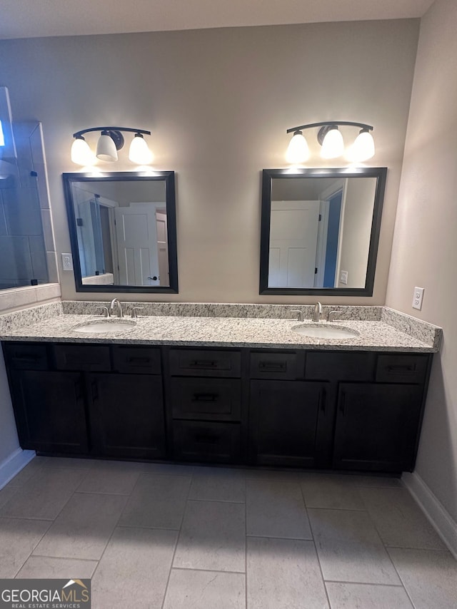 bathroom with tile patterned floors and vanity