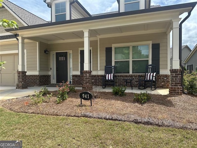 view of front of home with a garage and covered porch