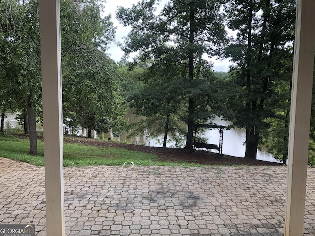 view of patio with a water view