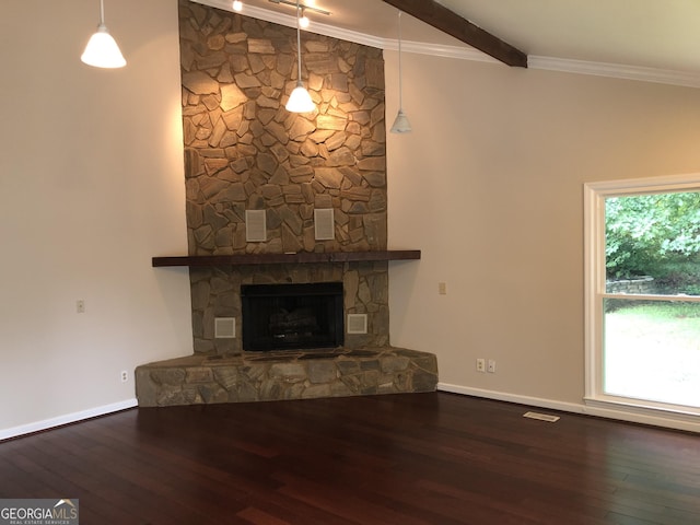 unfurnished living room featuring beam ceiling, hardwood / wood-style floors, a fireplace, and crown molding