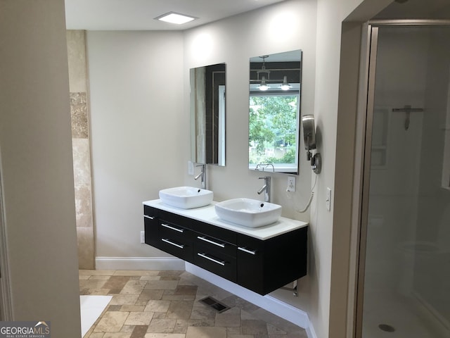 bathroom featuring vanity and walk in shower