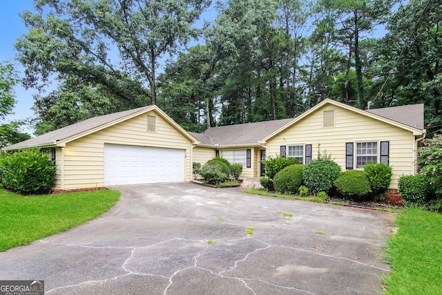 single story home featuring a garage