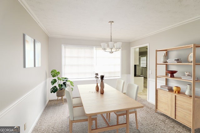 carpeted dining space featuring an inviting chandelier and crown molding