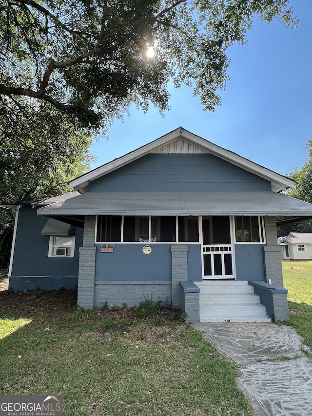 view of front of home with a front yard