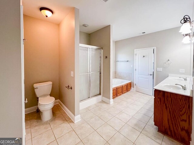 full bathroom with tile patterned flooring, vanity, plus walk in shower, and toilet