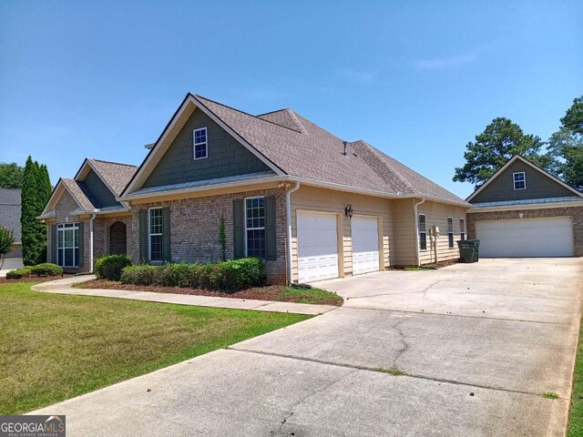 view of front of house featuring a garage and a front yard