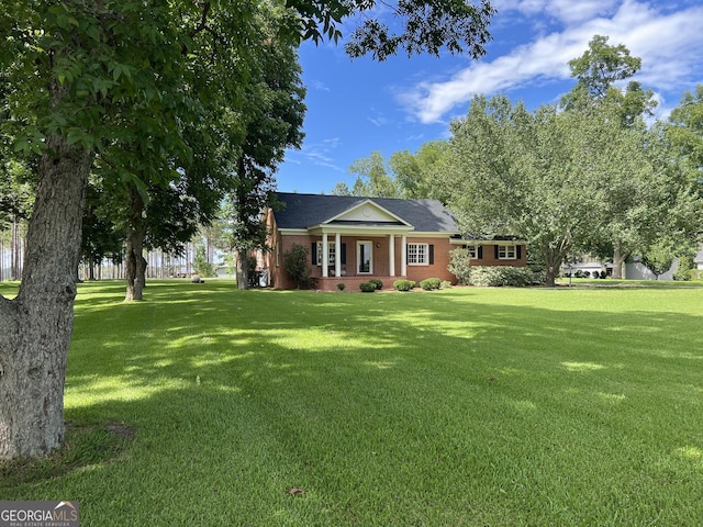 ranch-style house featuring a front lawn