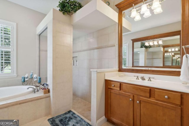 bathroom featuring tile patterned floors, plus walk in shower, and vanity