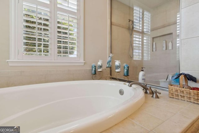 bathroom featuring tiled tub