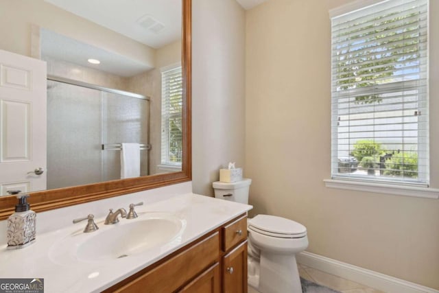 bathroom featuring tile patterned floors, toilet, and vanity