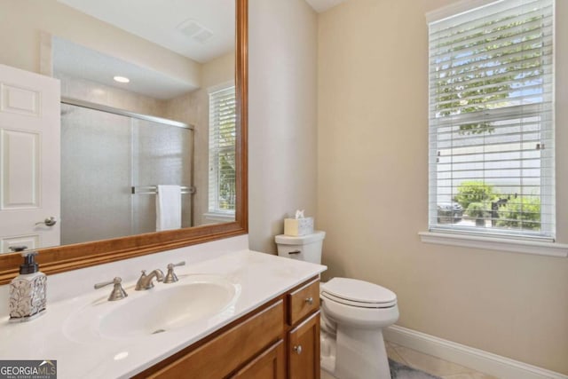 2491 Isles Of St Marys Way, Saint Marys, GA 31558 - bathroom featuring a stall shower, vanity, toilet, baseboards, and tile patterned floors