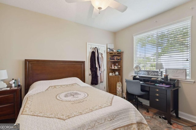 bedroom featuring ceiling fan and hardwood / wood-style floors