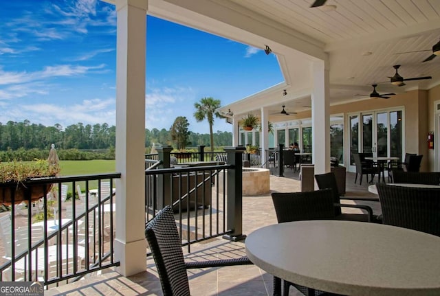 wooden deck featuring ceiling fan