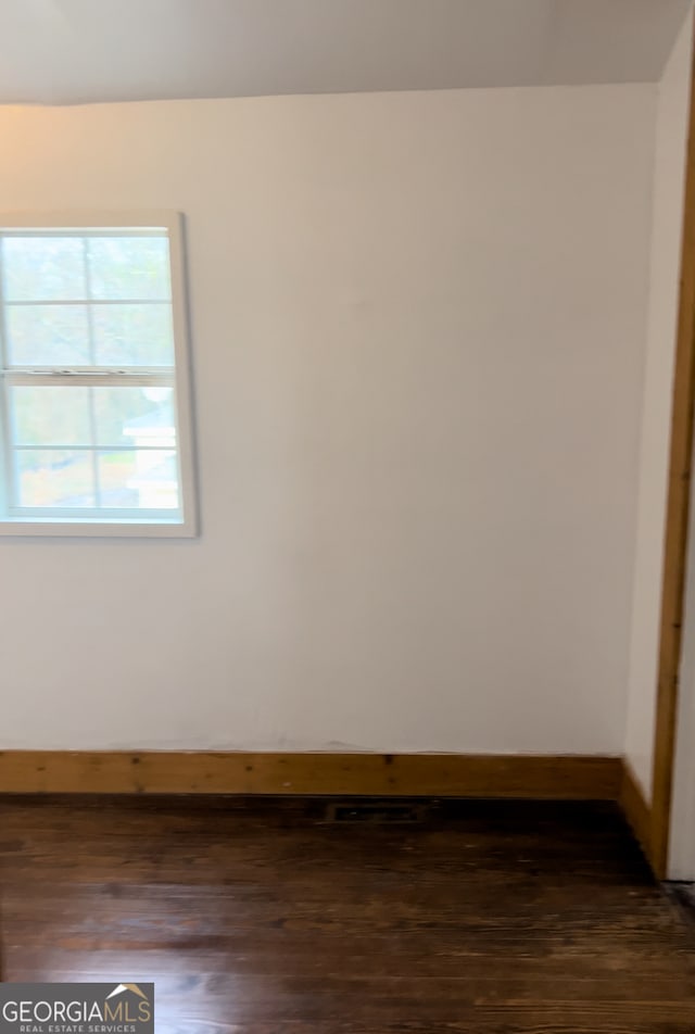 empty room featuring hardwood / wood-style floors