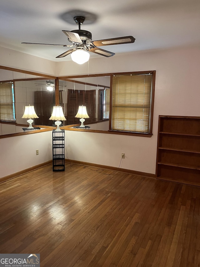 interior space with hardwood / wood-style floors and ceiling fan