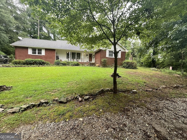 ranch-style house with a front lawn