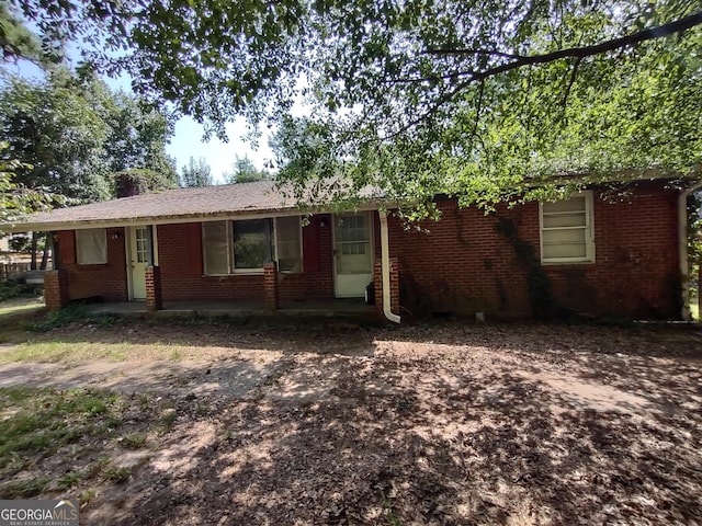 single story home with brick siding