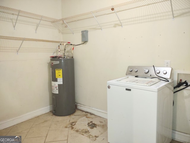 washroom featuring washer / clothes dryer, water heater, and light tile patterned floors