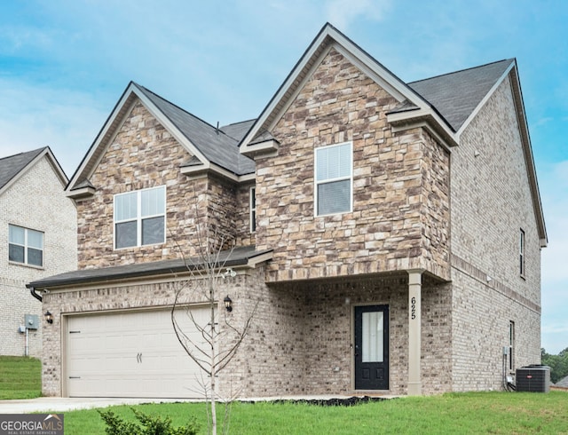 view of front facade with a front yard, cooling unit, and a garage