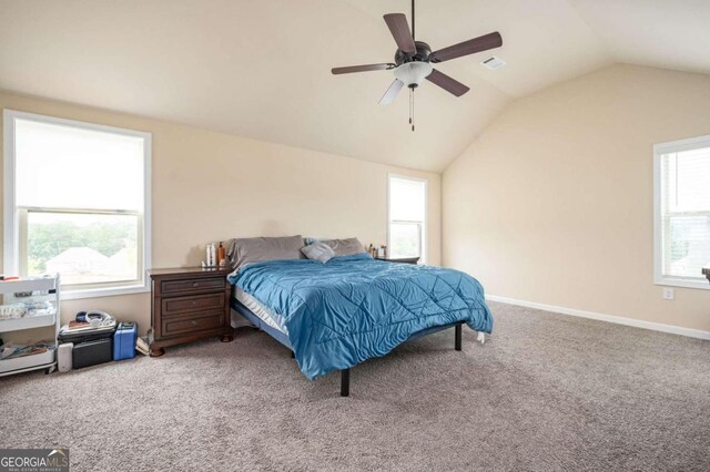 carpeted bedroom featuring vaulted ceiling and ceiling fan