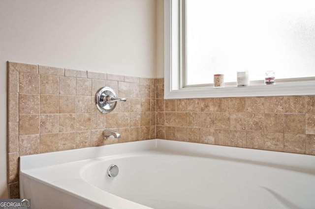 bathroom featuring a tub to relax in