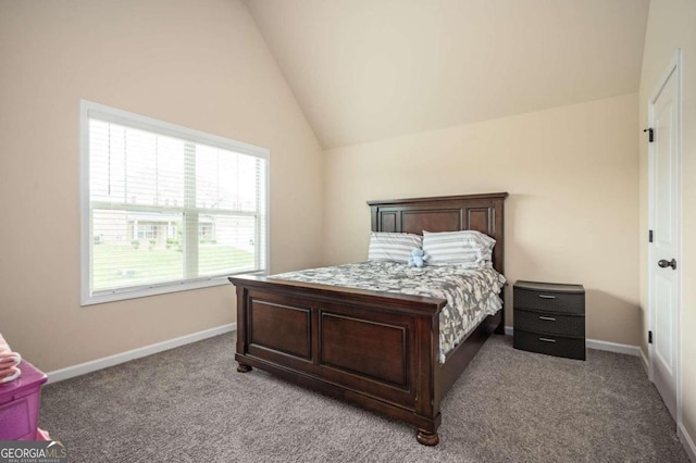 carpeted bedroom with lofted ceiling