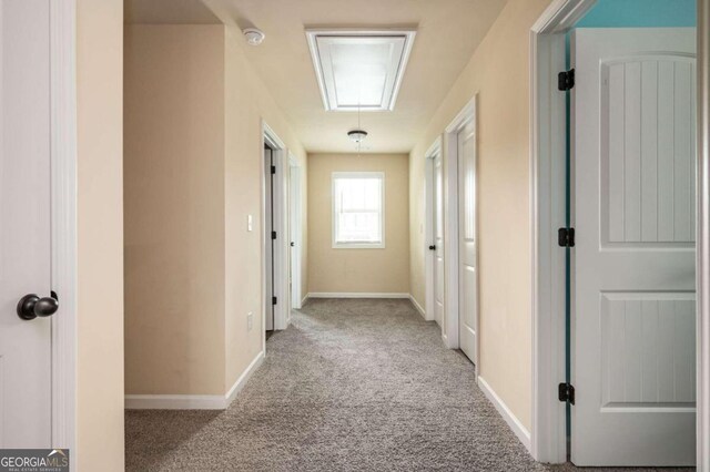 hallway with light carpet