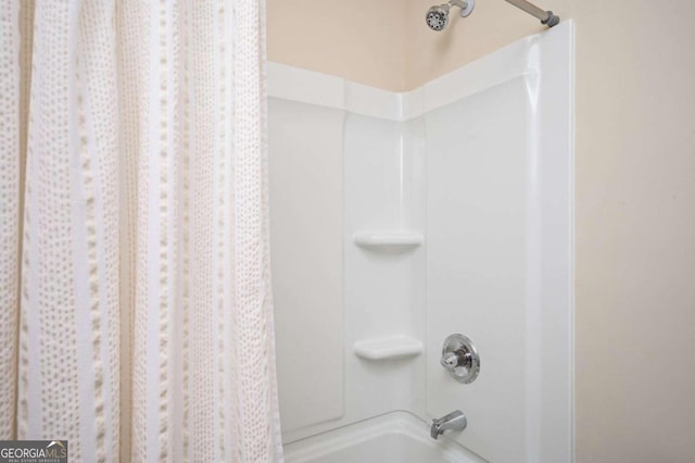 bathroom featuring shower / tub combo with curtain