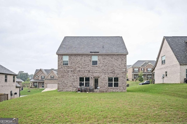 back of house with a yard