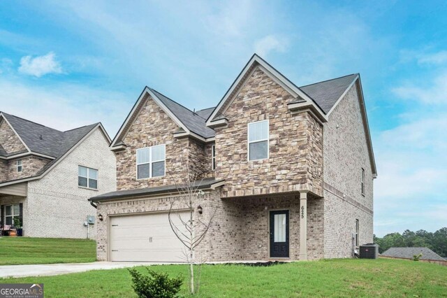 view of front of property with a garage, a front lawn, and central air condition unit