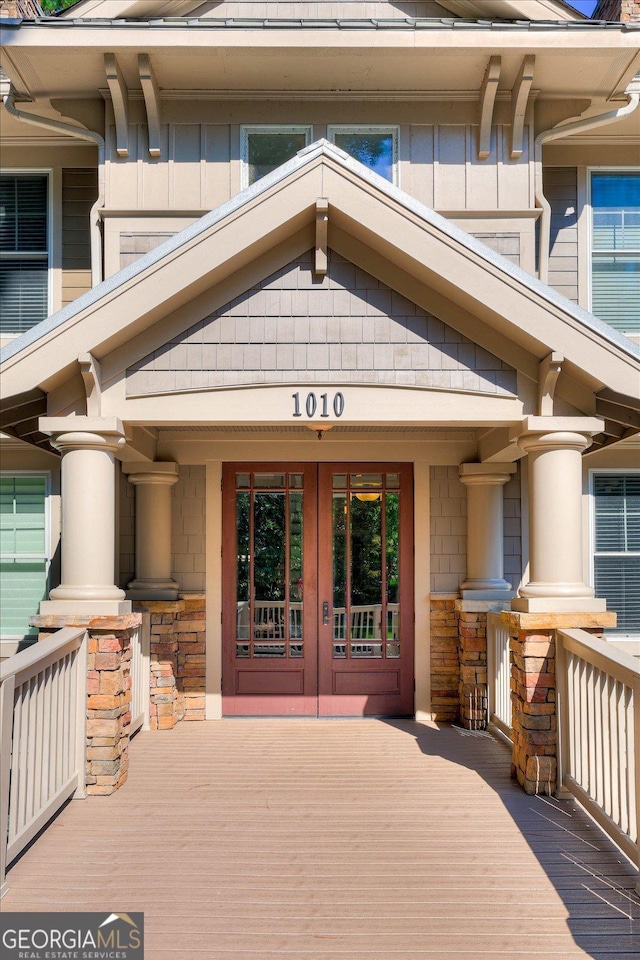 view of exterior entry featuring french doors