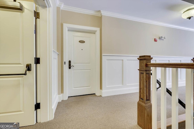 corridor with light colored carpet and crown molding