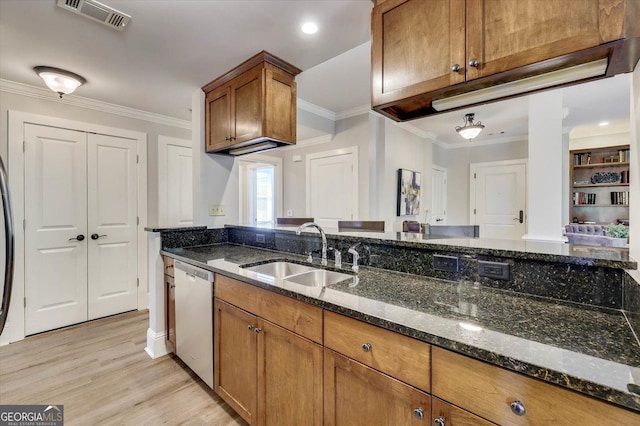 kitchen featuring stainless steel dishwasher, sink, dark stone countertops, light hardwood / wood-style flooring, and ornamental molding