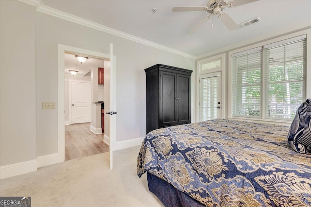 bedroom featuring light colored carpet, ceiling fan, and ornamental molding