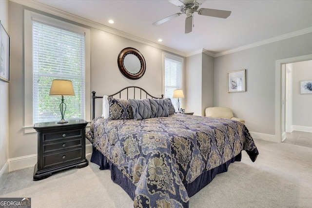 bedroom featuring ornamental molding, ceiling fan, light colored carpet, and multiple windows