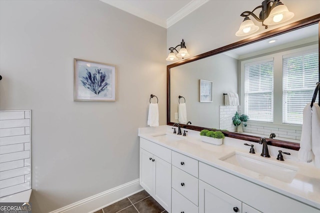 bathroom with crown molding, tile patterned flooring, and vanity